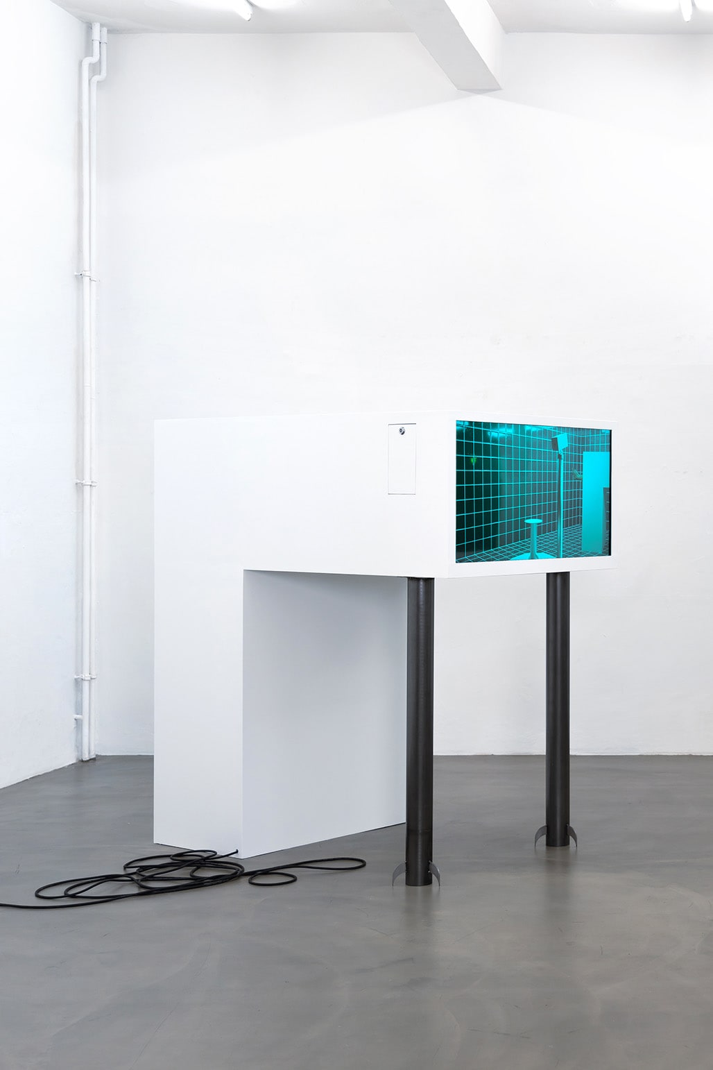 installation shot of n∰menon, showing a sculpture that integrates video